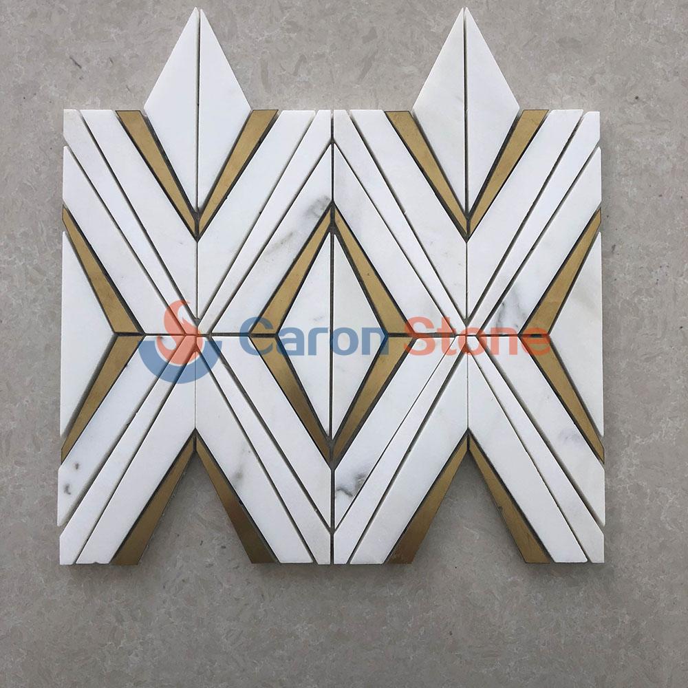 White marble with brass waterjet mosaic
