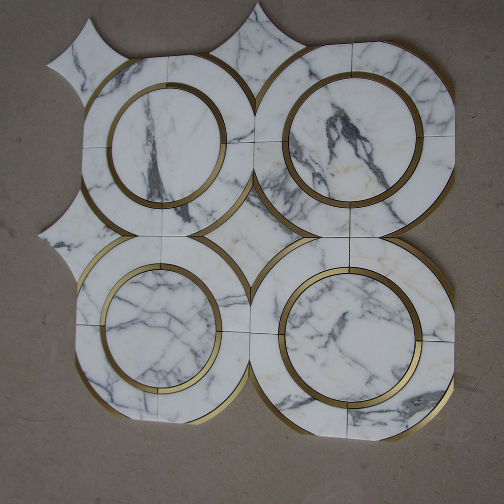 Calacatta marble with brass waterjet mosaic
